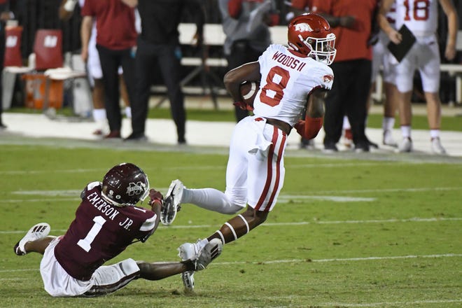 Arkansas wide receiver Mike Woods (8) breaks away from Mississippi State cornerback Martin Emerson (1) during the first half of an NCAA college football game in Starkville, Miss., Saturday, Oct. 3, 2020.