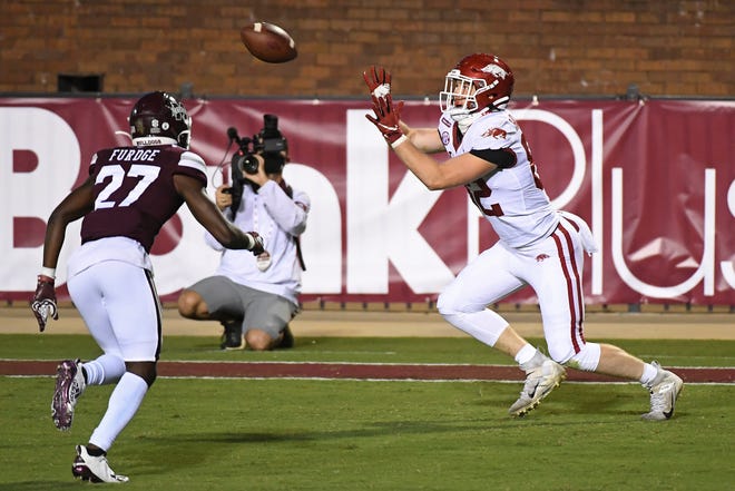 Arkansas tight end Hudson Henry (82) catches a 12-yard touchdown pass during the second half of the team's NCAA college football game against Mississippi State in Starkville, Miss., Saturday, Oct. 3, 2020. Arkansas won 21-14.