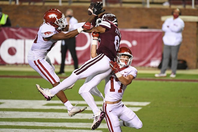 Arkansas defensive backs Simeon Blair (15) and Hudson Clark (17) break up a pass intended for Mississippi State wide receiver JaVonta Payton (0) during the second half of an NCAA college football game in Starkville, Miss., Saturday, Oct. 3, 2020. Arkansas won 21-14.