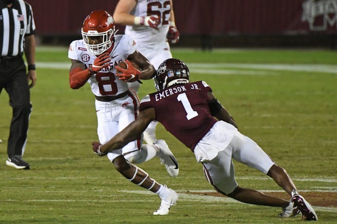 Mississippi State cornerback Martin Emerson (1) tackles Arkansas wide receiver Mike Woods (8) during the second half of an NCAA college football game in Starkville, Miss., Saturday, Oct. 3, 2020. Arkansas won 21-14.