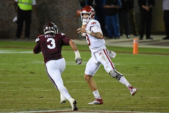 Arkansas quarterback Feleipe Franks (13) releases a pass past Mississippi State linebacker Aaron Brule (3) during the first half of an NCAA college football game in Starkville, Miss., Saturday, Oct. 3, 2020.