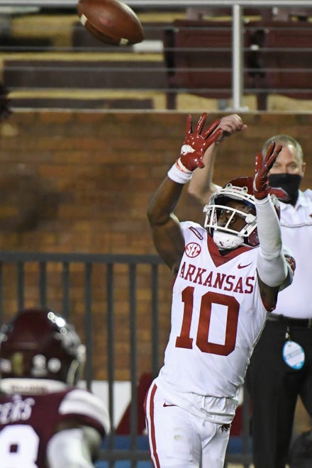 Arkansas wide receiver De'Vion Warren (10) catches a pass for a touchdown during the first half of the team's NCAA college football game against Mississippi State in Starkville, Miss., Saturday, Oct. 3, 2020.