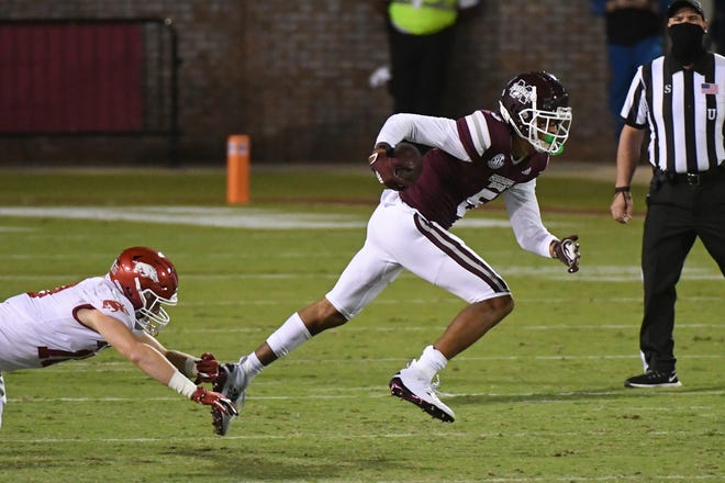 Mississippi State wide receiver Osirus Mitchell (5) runs the ball past Arkansas linebacker Bumper Pool (10) during the first half of an NCAA college football game in Starkville, Miss., Saturday, Oct. 3, 2020.