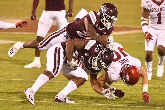 Oct 3, 2020; Starkville, Mississippi, USA; Mississippi State Bulldogs wide receiver Brad Cumbest (25) collides with running back Jo'quavious Marks (21) as he attempts to block Arkansas Razorbacks linebacker Bumper Pool (10) during the second quarter at Davis Wade Stadium at Scott Field.