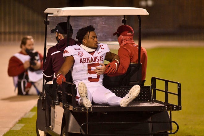 Oct 3, 2020; Starkville, Mississippi, USA; Arkansas Razorbacks running back Rakeem Boyd (5) is carted off the field during the second quarter of the game against the Mississippi State Bulldogs at Davis Wade Stadium at Scott Field.